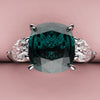 teal sapphire and diamond trilogy engagement ring 