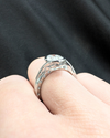 Flowing Vine Oval Diamond Engagement Ring with Hidden Diamonds