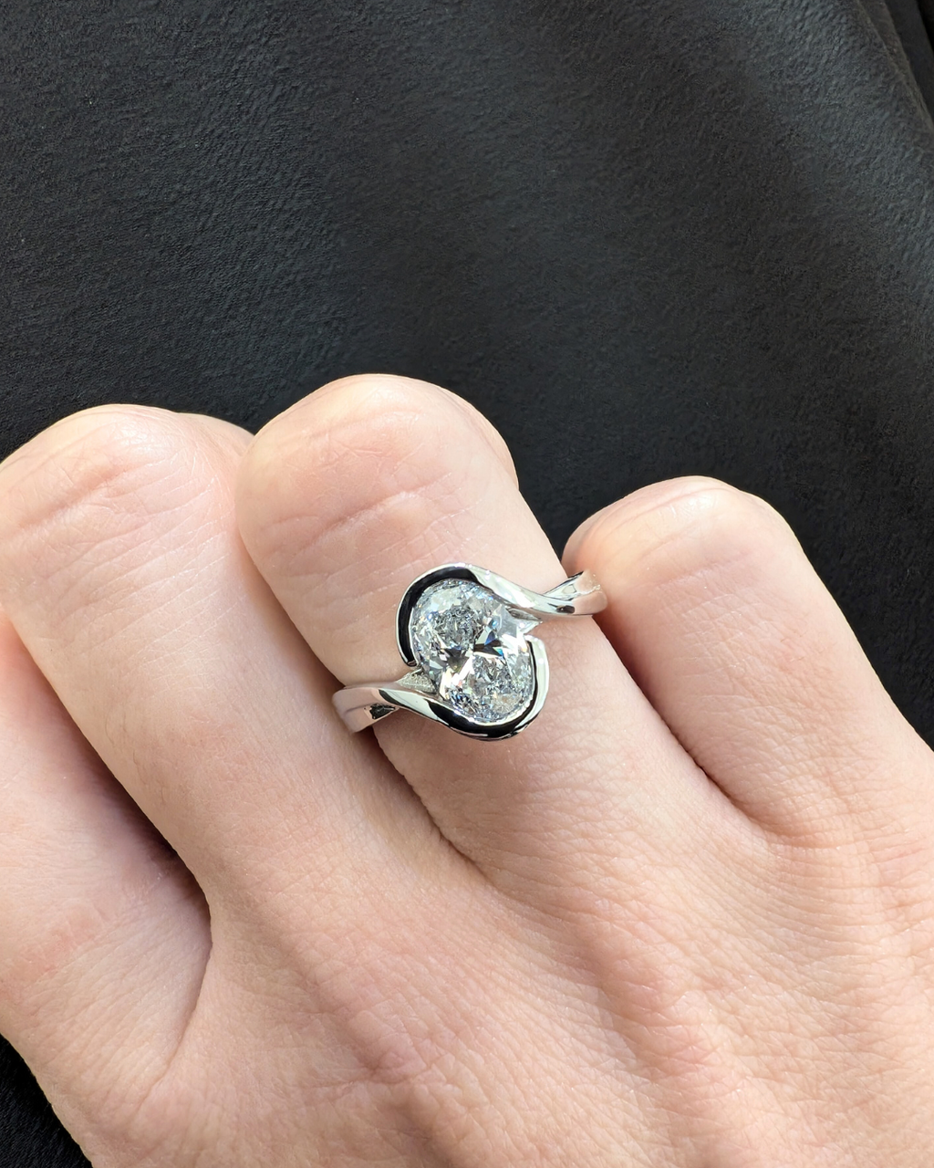 Flowing Vine Oval Diamond Engagement Ring with Hidden Diamonds