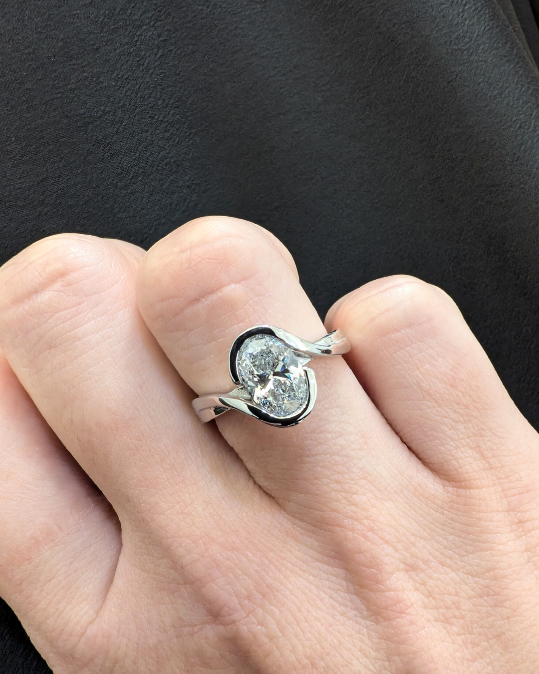 Flowing Vine Oval Diamond Engagement Ring with Hidden Diamonds