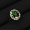 green emerald cluster engagement ring