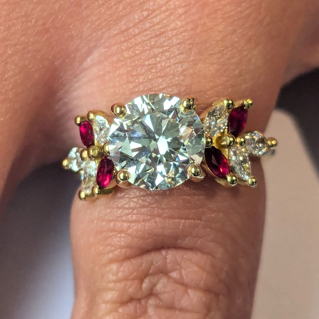 Round Brilliant Cut Diamond With Marquise Ruby Accent Stones