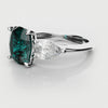 teal sapphire and diamond three stone engagement ring 