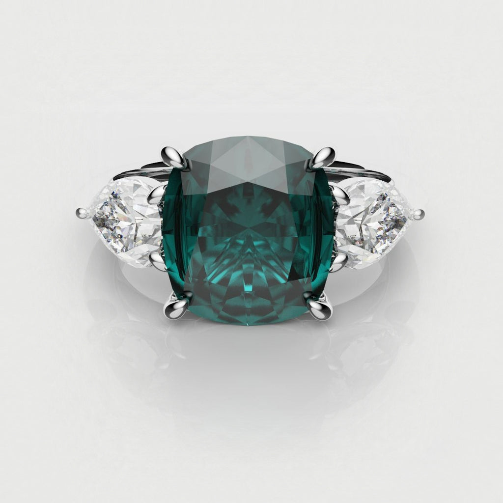 cushion cut teal sapphire triligy engagement ring