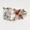 Round Brilliant Cut Diamond With Marquise Ruby Accent Stones