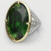 green oval and diamond engagement ring