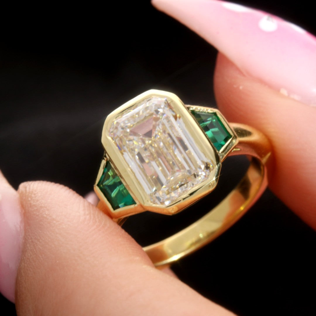 Emerald Cut Trilogy Engagement Ring With Green Emerald Trapezoids
