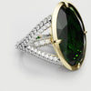 split shank green emerald and oval engagement ring