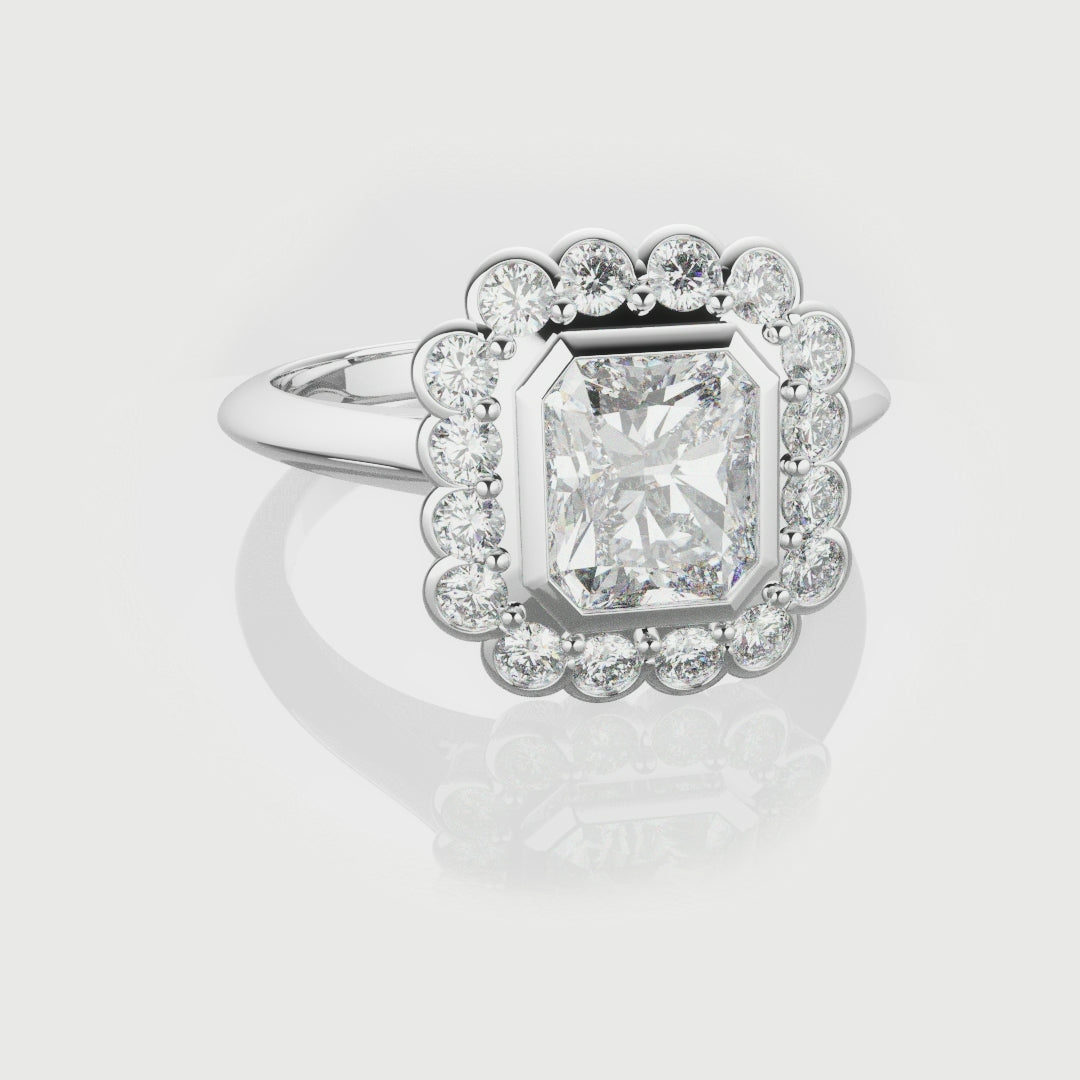 Radiant Cut Diamond Halo Engagement Ring With Rub-over Setting