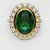 oval green emerald engagement ring