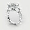 trilogy engagement ring with pear and trilliant shoulder diamonds