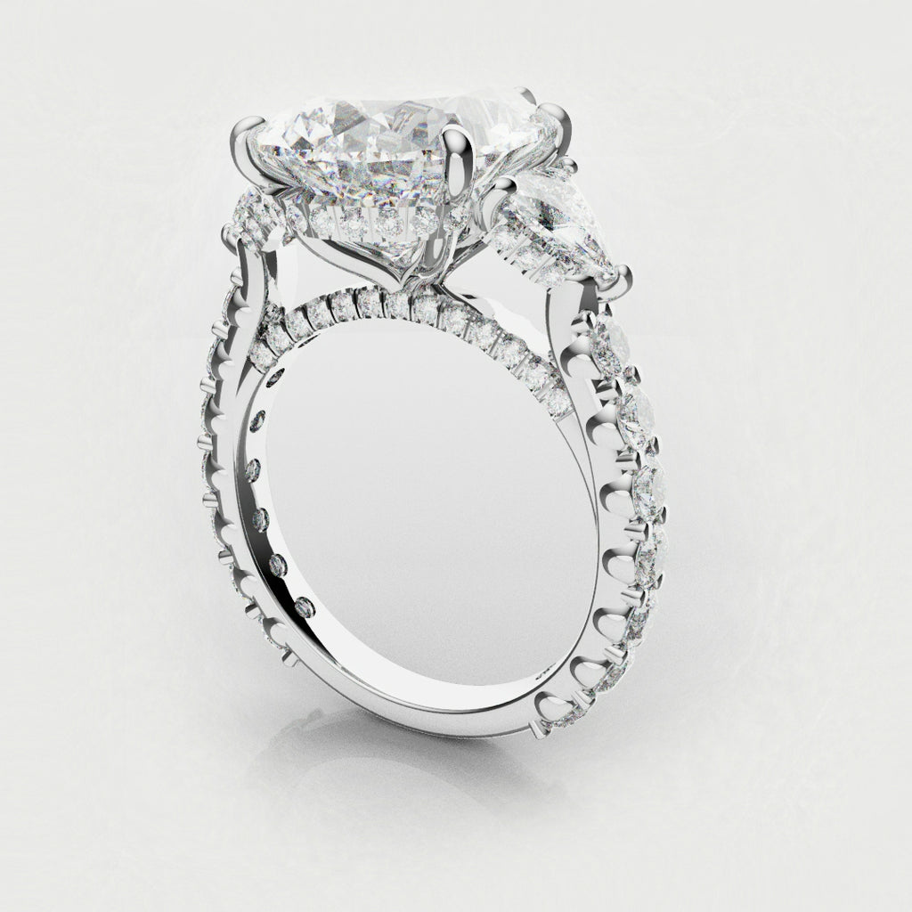 trilogy engagement ring with pear and trilliant shoulder diamonds