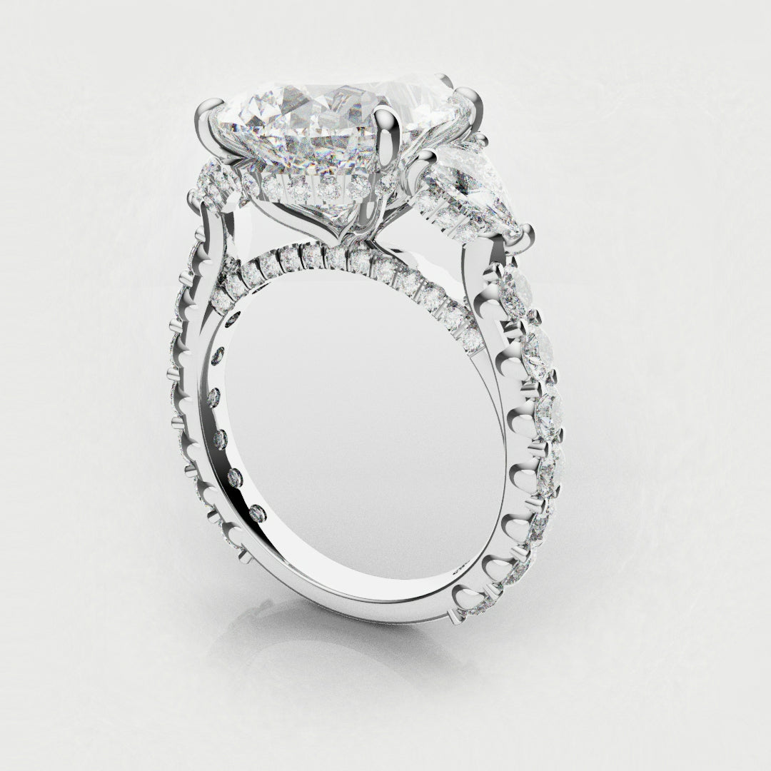 trilogy engagement ring with pear and trilliant shoulder diamonds