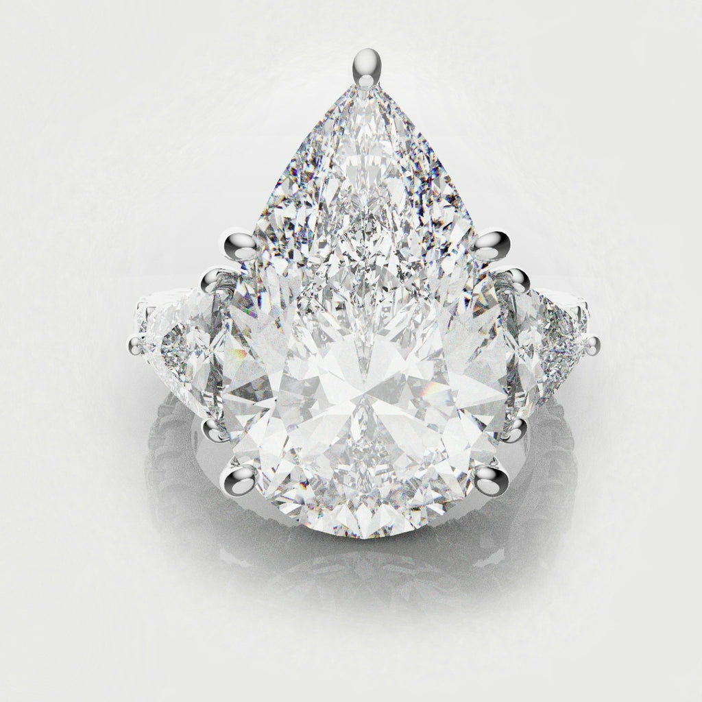 pear and trilliant diamond three stone engagemenrt ring