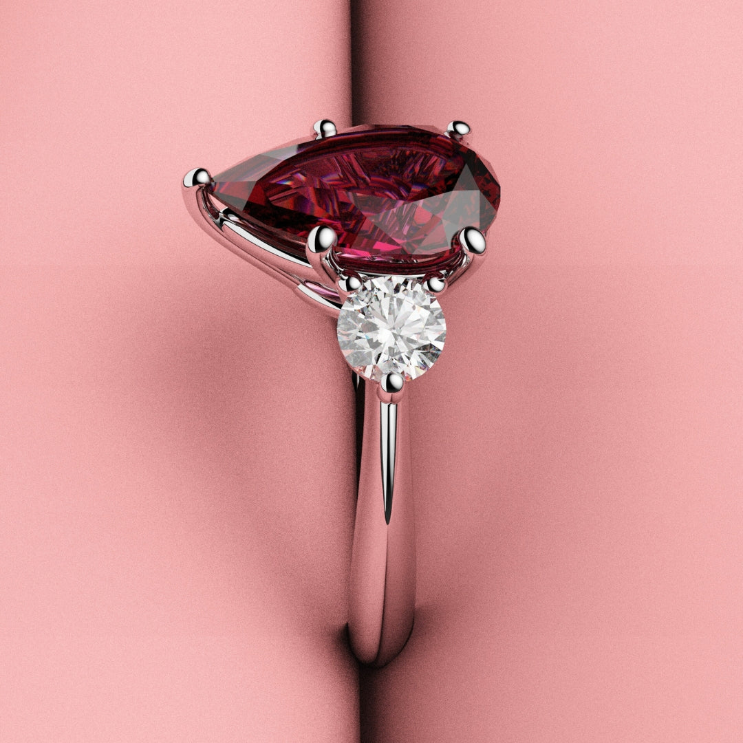 pear shaped ruby three stone engagement ring 
