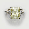 yellow diamond trilogy engagement ring with radiant cut center diamond and trilliant shoulder diamonds on an elegant 18ct yellow gold band
