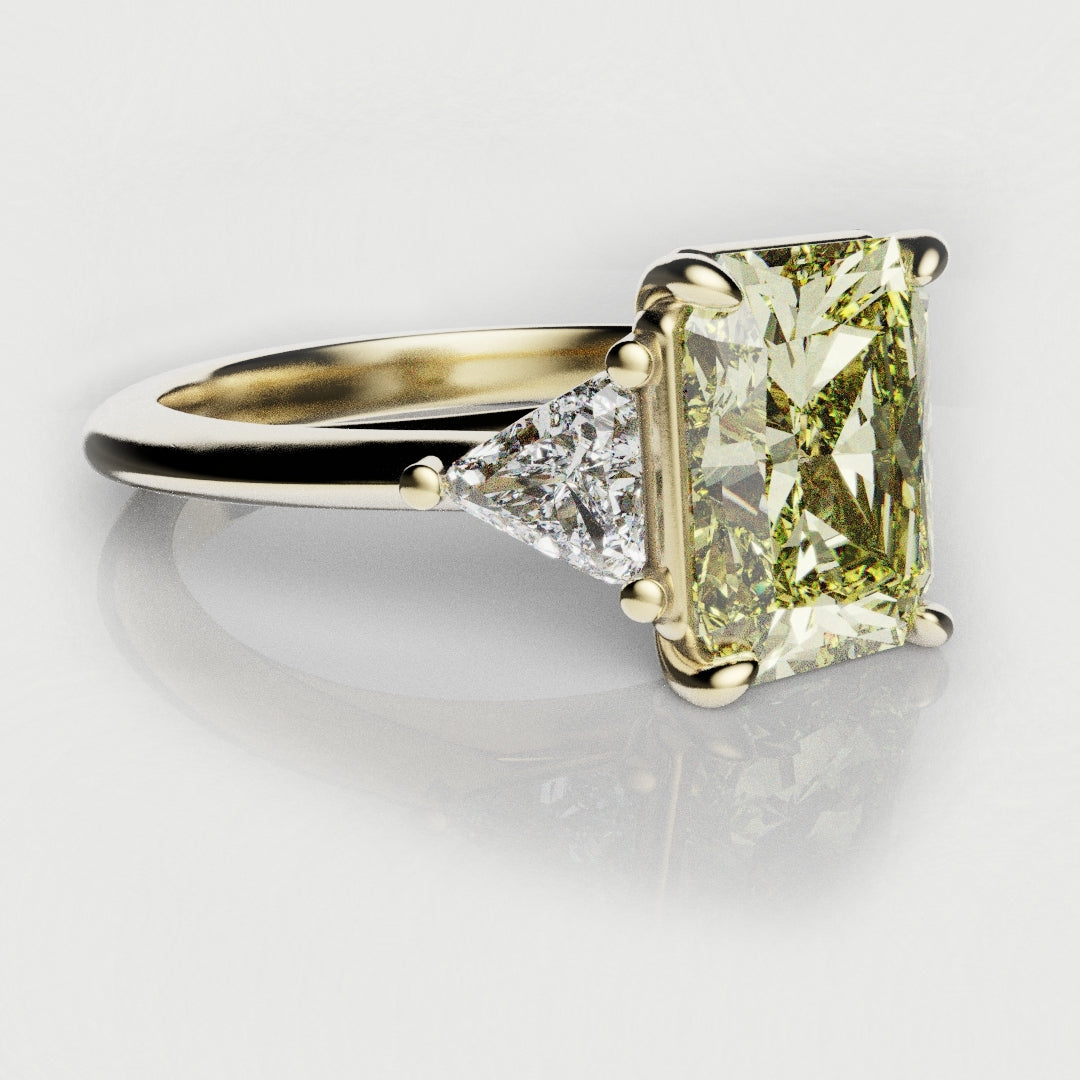 yellow diamond engagement ring in 18ct yellow gold with trilliant shoulder diamonds 