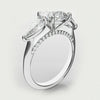 round and pear diamond three stone engagement ring