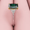 radiant cut teal sapphire trilogy engagement ring with trilliant shoulder diamonds