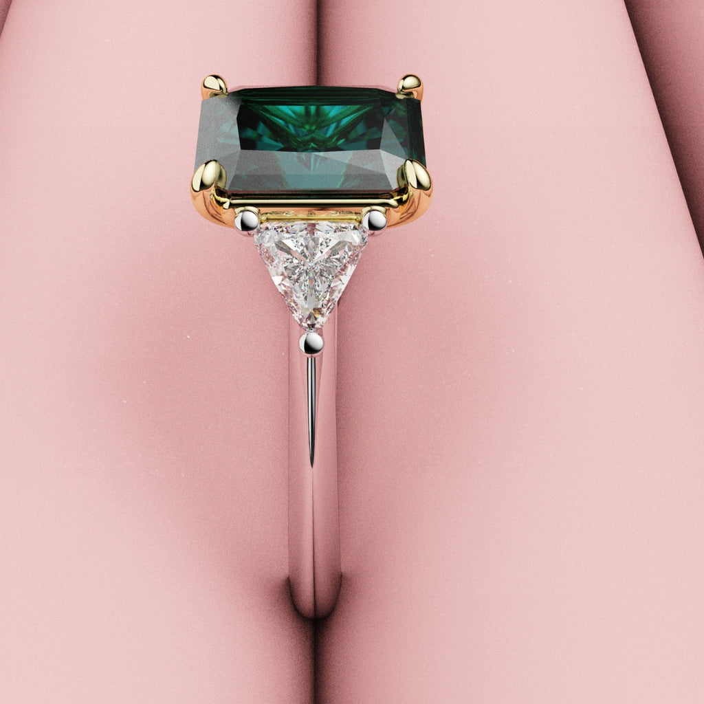 radiant cut teal sapphire trilogy engagement ring with trilliant shoulder diamonds
