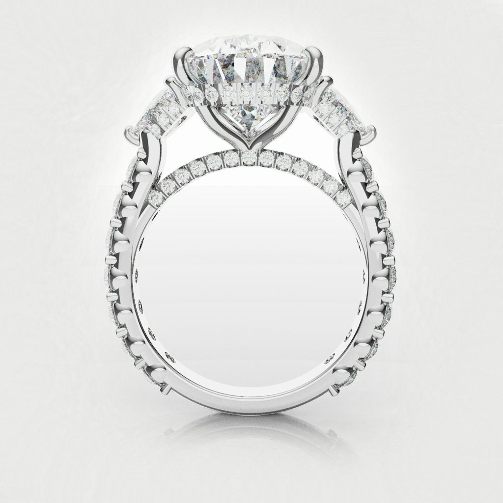 three stone engagement ring with pear and trilliant diamonds 