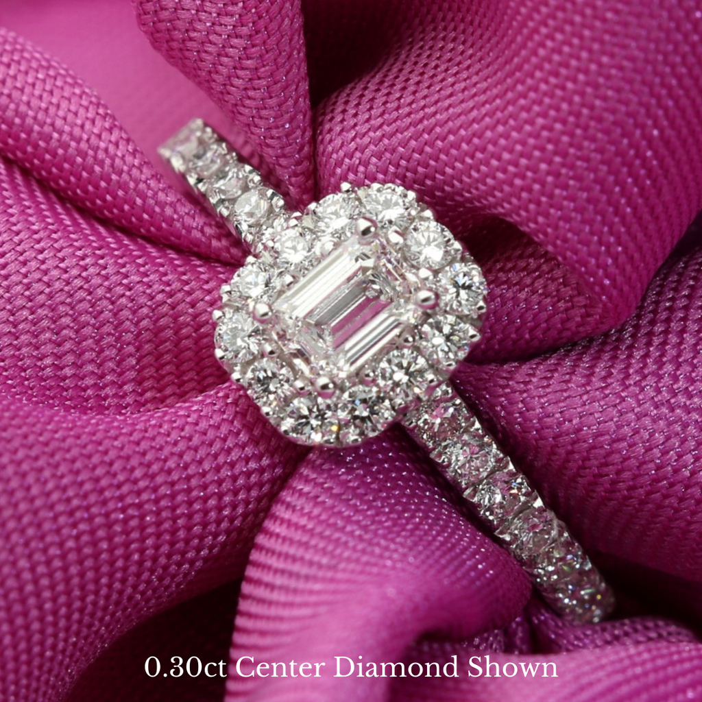 Halo engagement ring set with emerald cut diamond