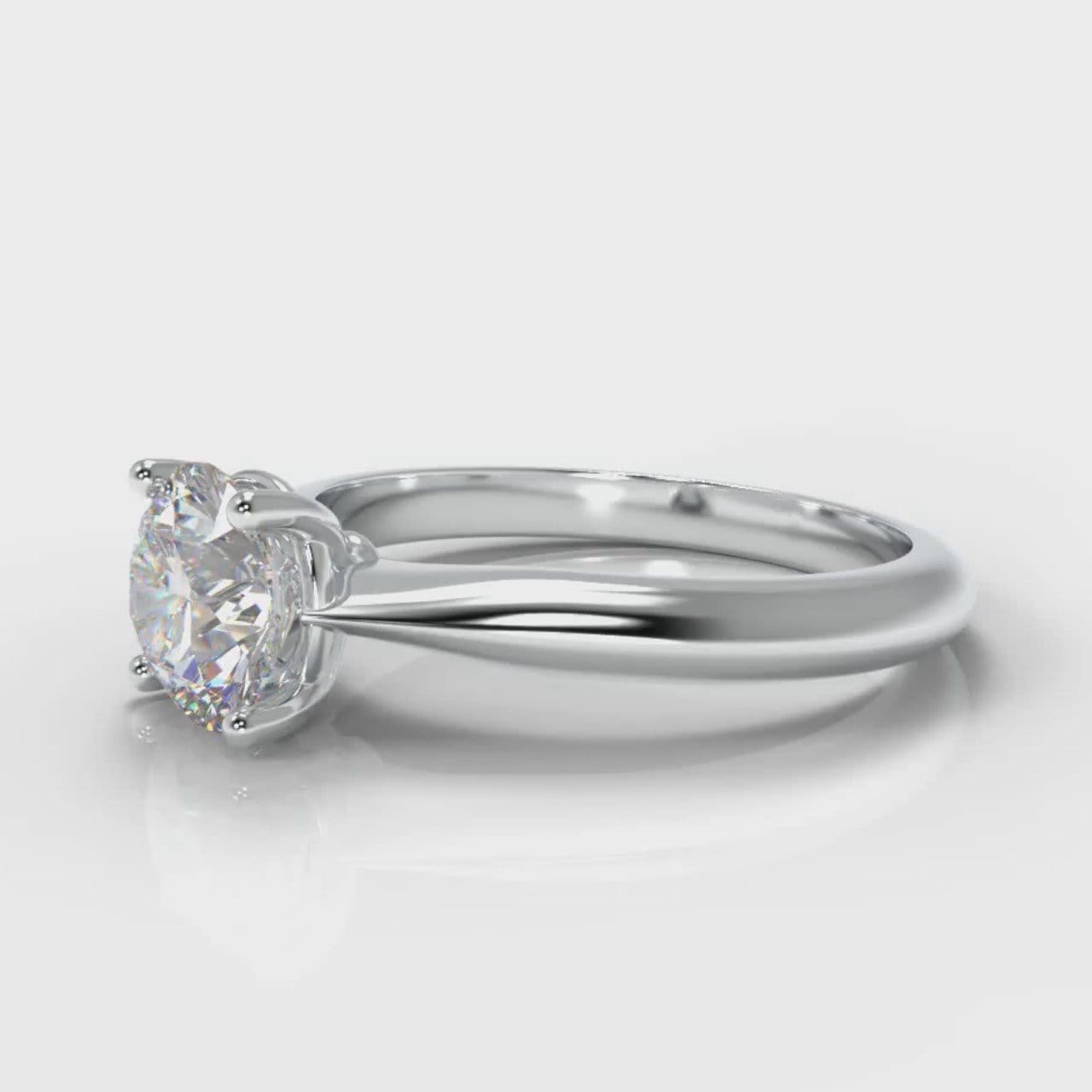 Four claw solitaire engagement ring