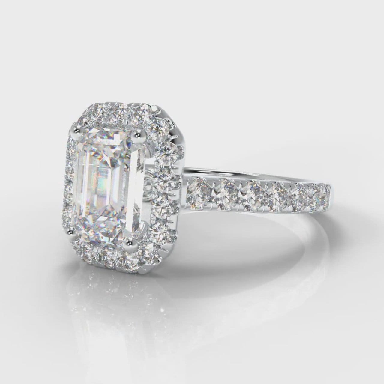 Emerald cut diamond halo engagement ring