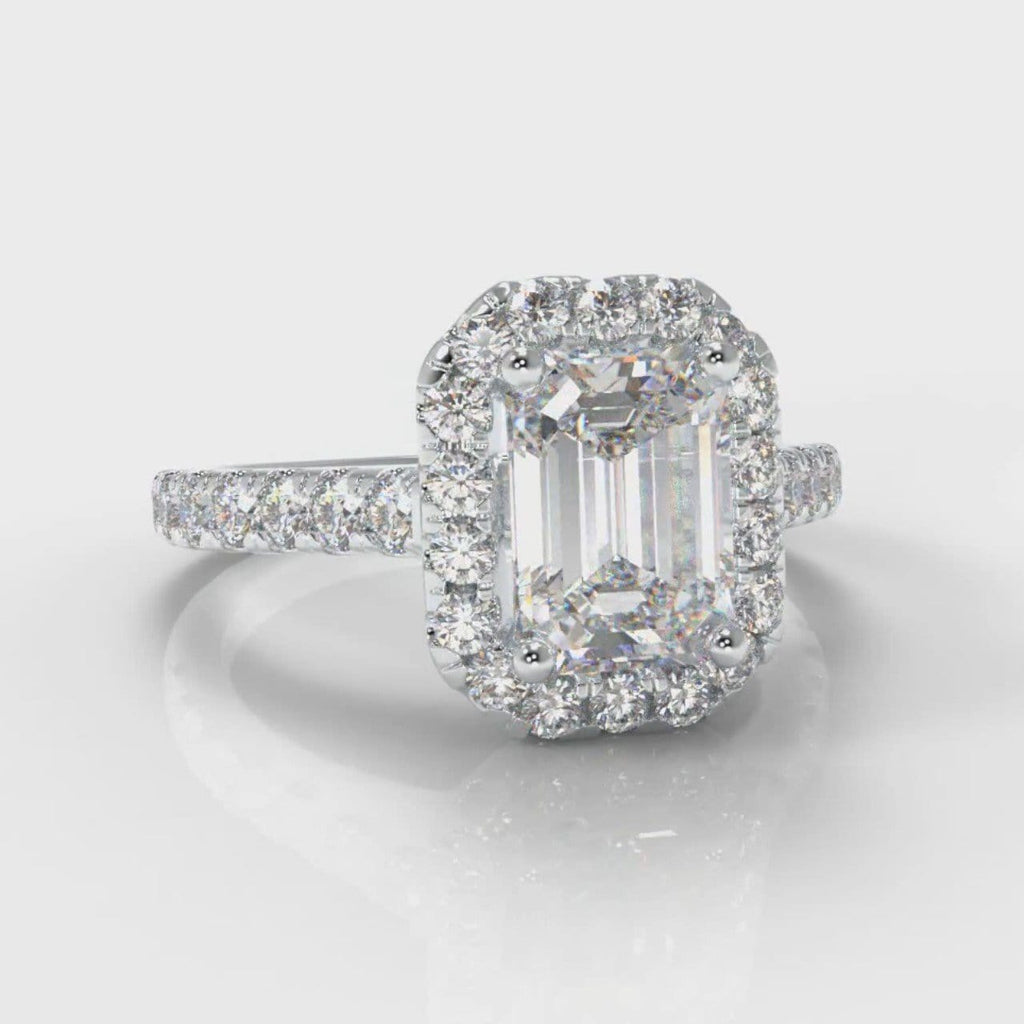 Emerald cut diamond engagement ring set with a diamond halo