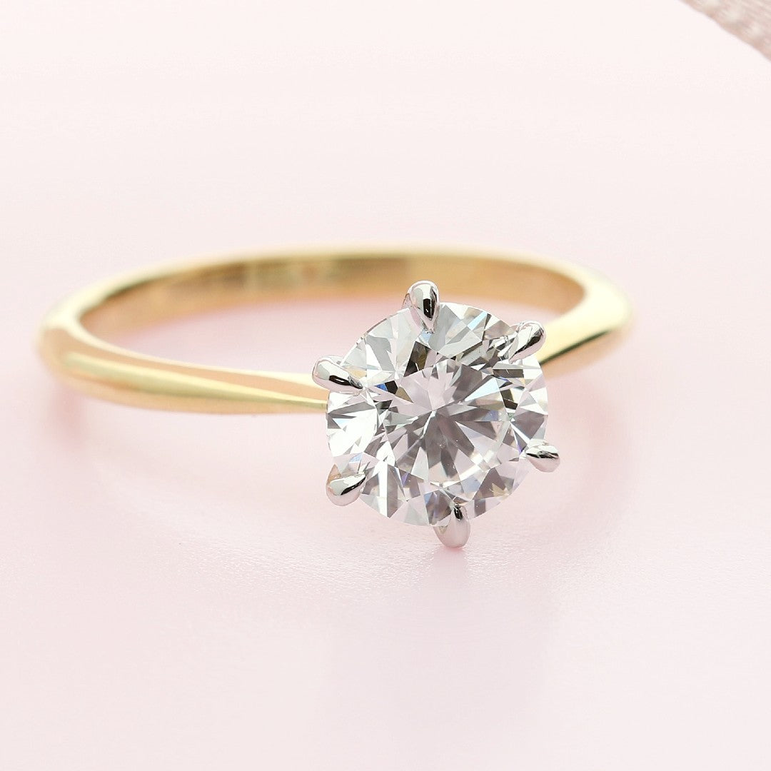 Solitaire diamond engagement ring yellow gold