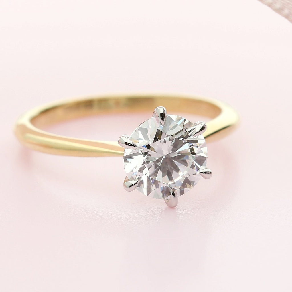 Solitaire diamond engagement ring yellow gold